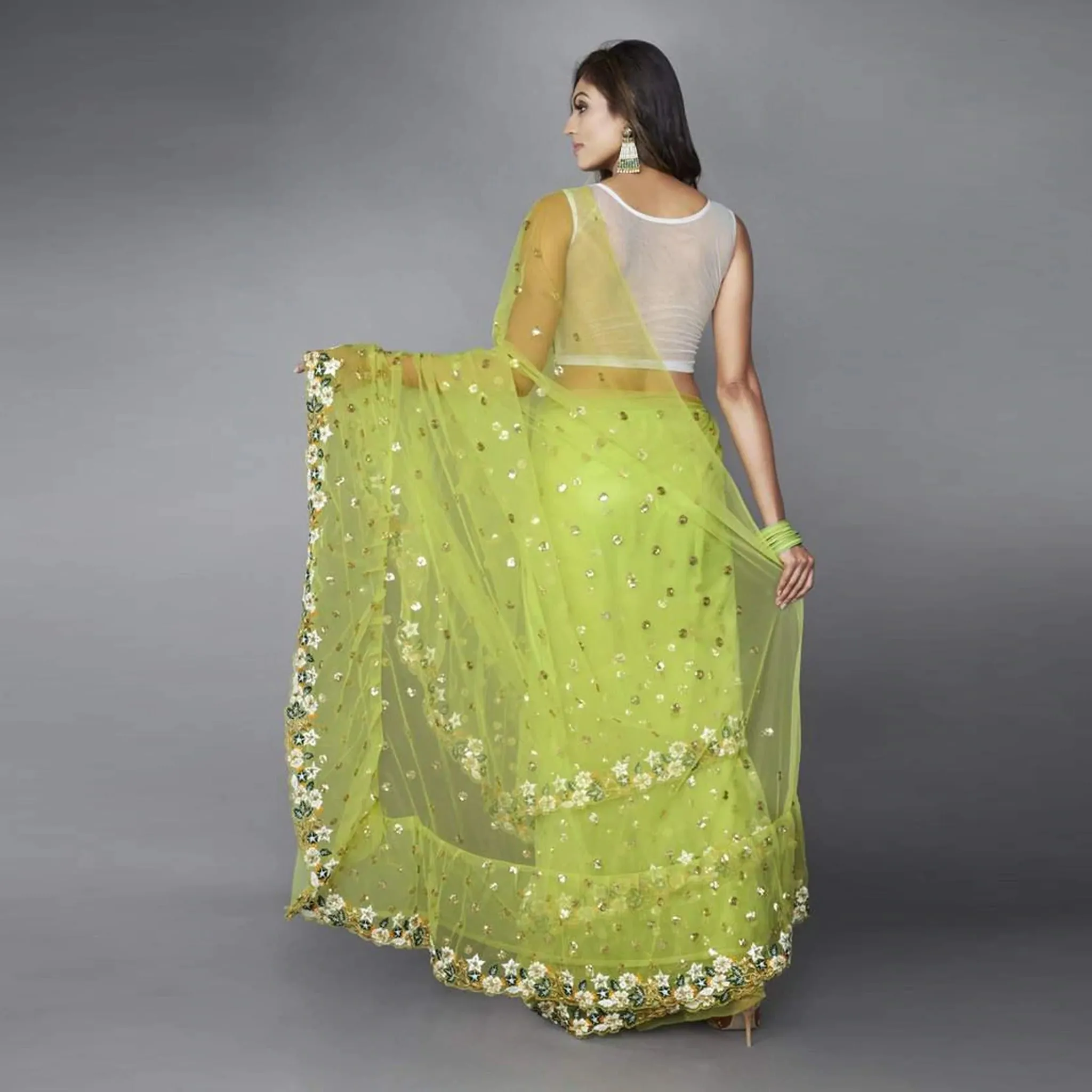 Green Ruffle Saree in Soft Net Fabrics with Embroidery Work